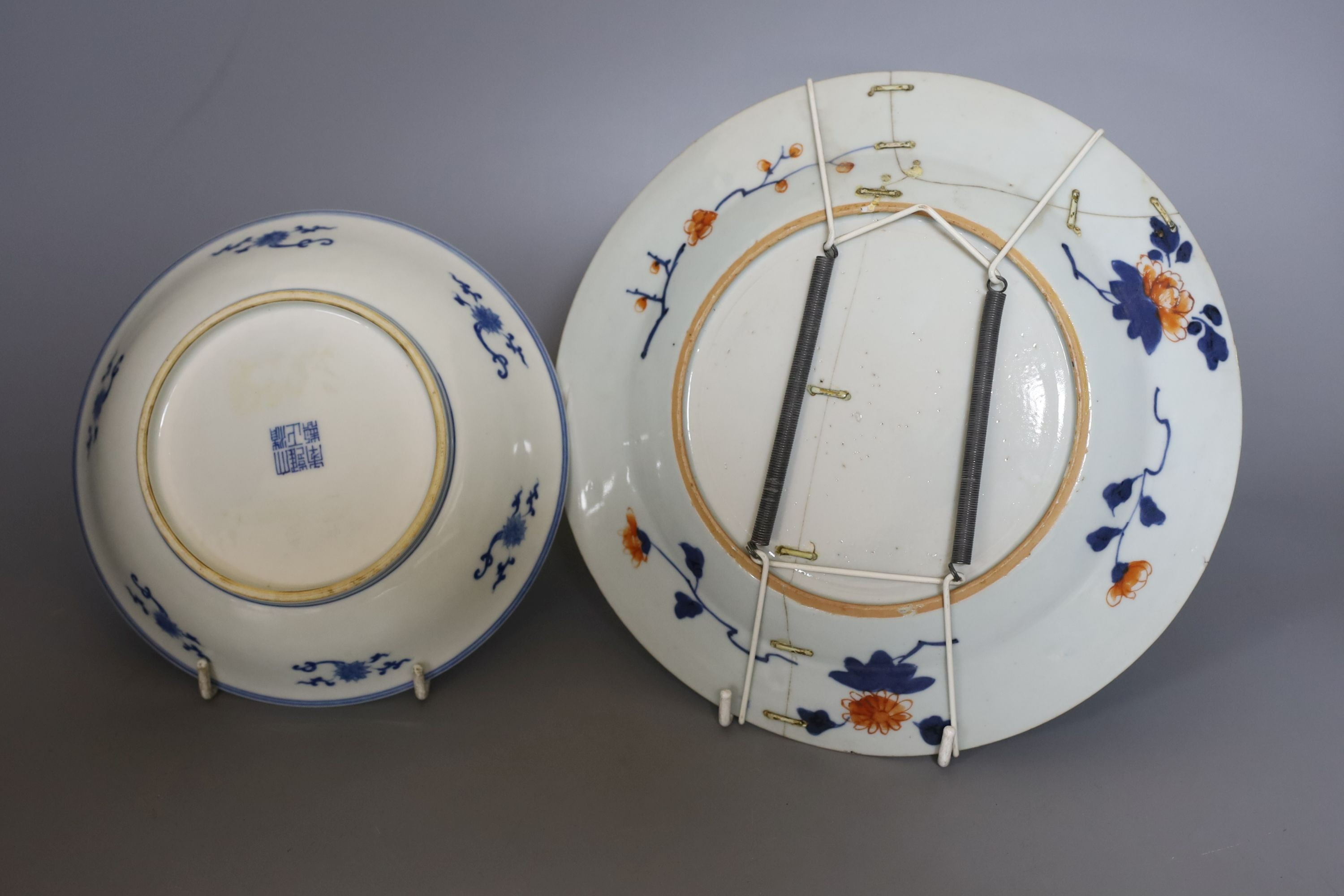 Three Chinese plates including a 19th century Chinese Imari dish, 23cm - repaired, a Chinese famille rose crackleglaze vase, 29cm, together with a famille rose teapot and a crackleglaze celadon ground bottle vase. Talles